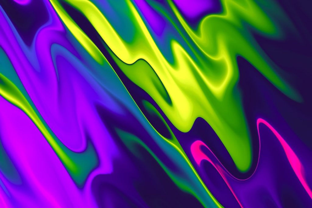 Abstract image featuring smooth, wavy streaks of neon green, purple, pink, and blue, blending and flowing together in a vibrant, fluid pattern.